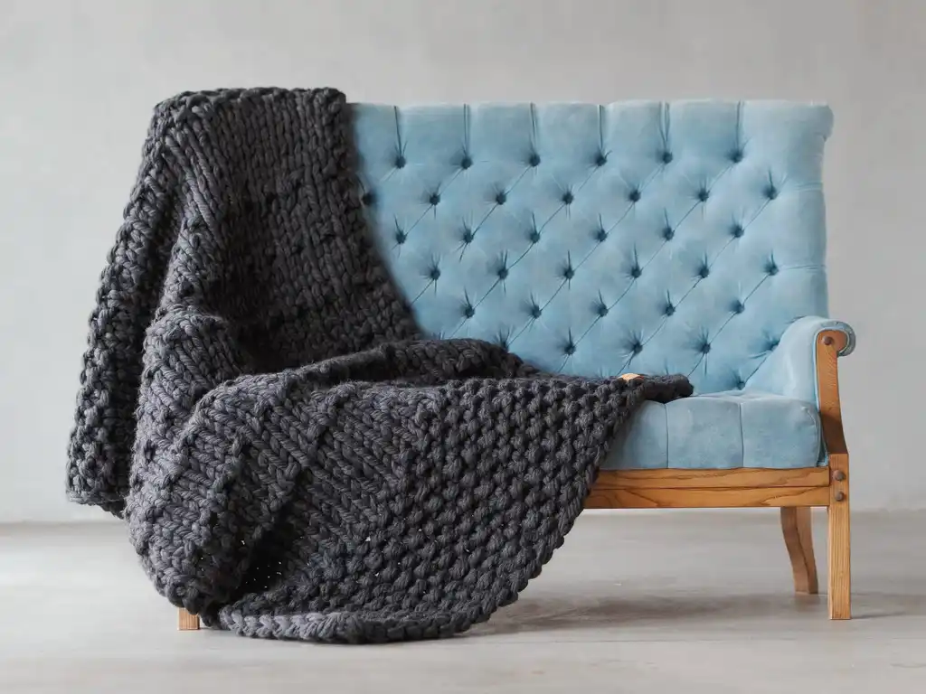 chunky wool knit blanket in natural tones, handcrafted traditional knitting.