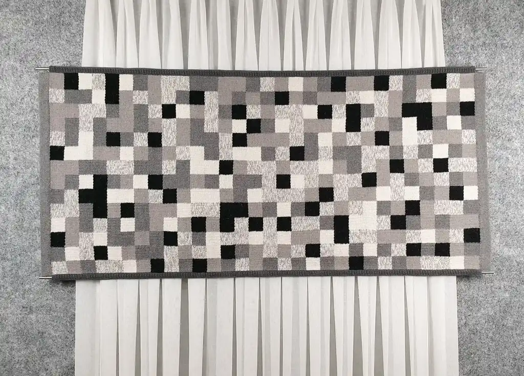 handwoven wool wall hanging textile art piece.