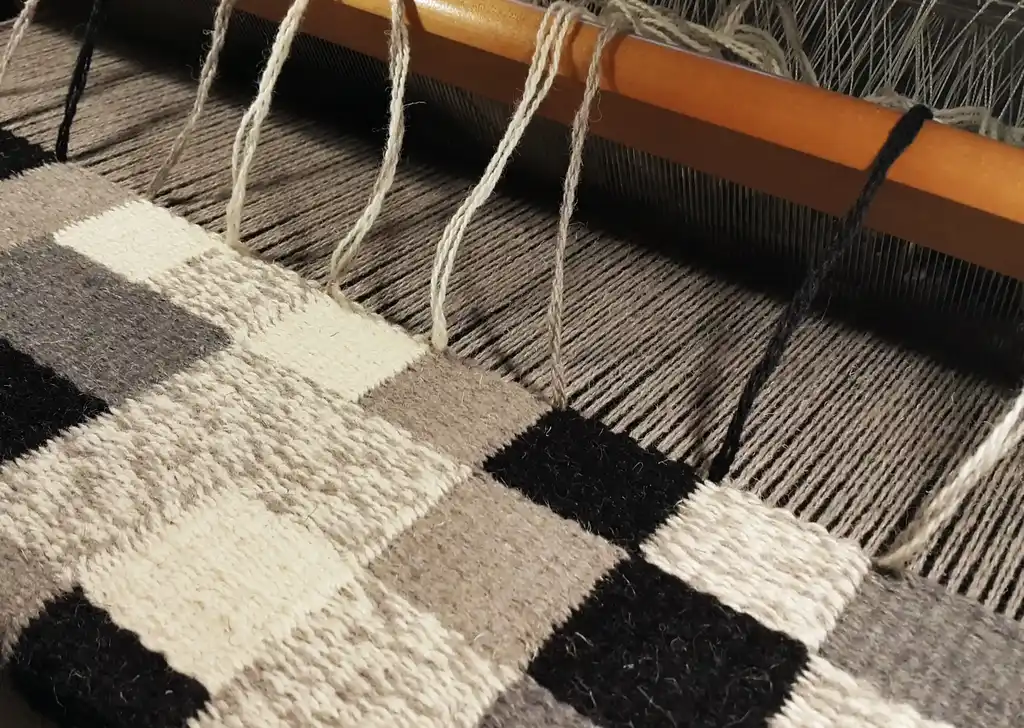 handwoven wool wall hanging textile art piece.