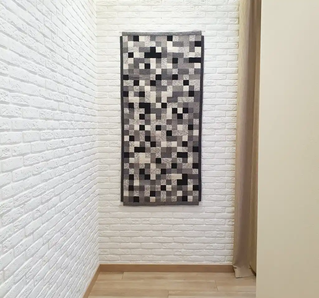 handwoven wool wall hanging textile art piece.