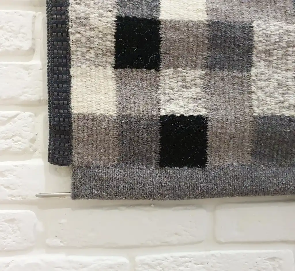 handwoven wool wall hanging textile art piece.