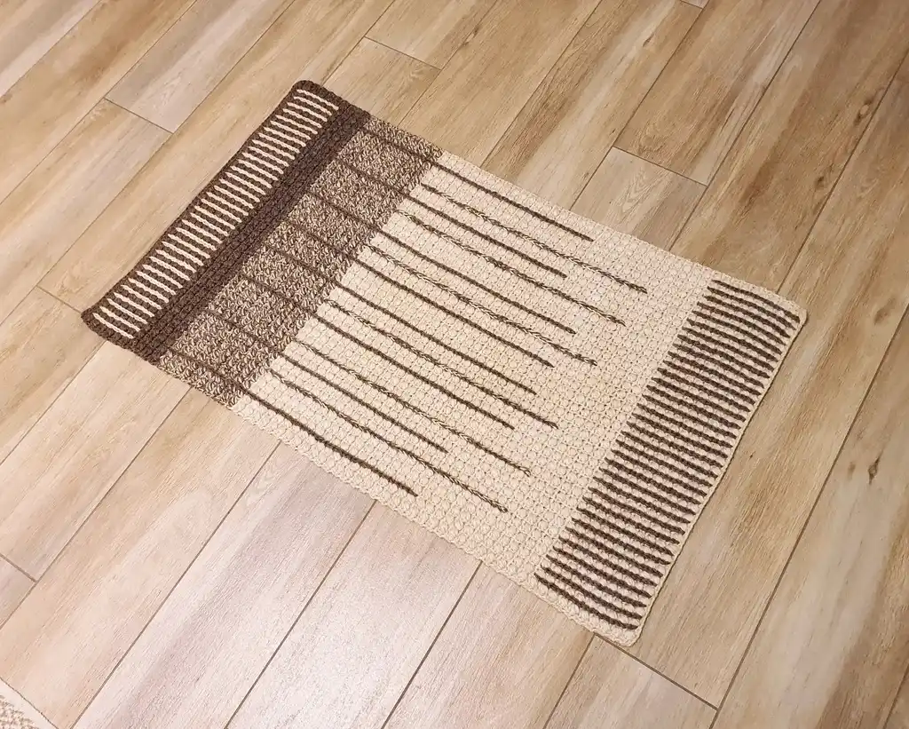 handmade crochet wool rug in neutral tones, showcasing artisan craftsmanship and premium quality materials.
