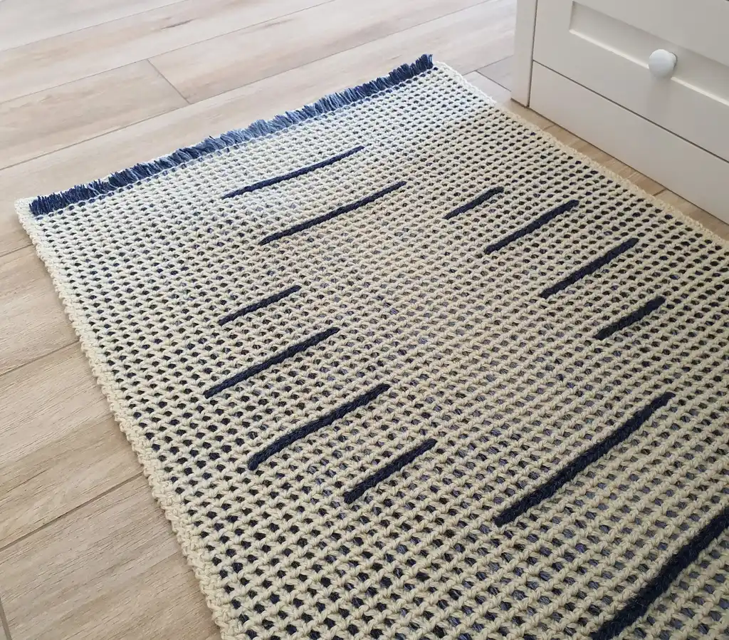 handmade crochet wool rug with intricate pattern, machine washable home decor.