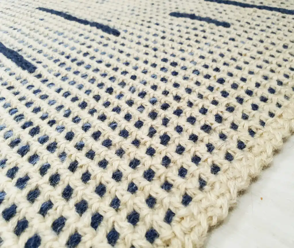 handmade crochet wool rug with intricate pattern, machine washable home decor.