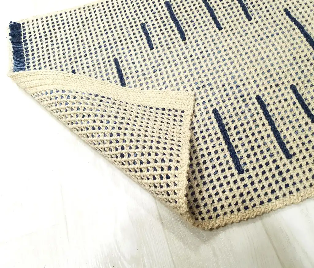 handmade crochet wool rug with intricate pattern, machine washable home decor.