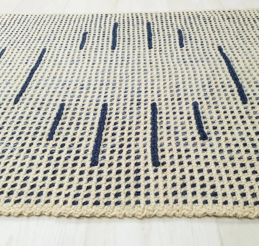 handmade crochet wool rug with intricate pattern, machine washable home decor.
