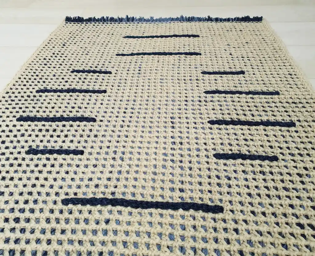 handmade crochet wool rug with intricate pattern, machine washable home decor.