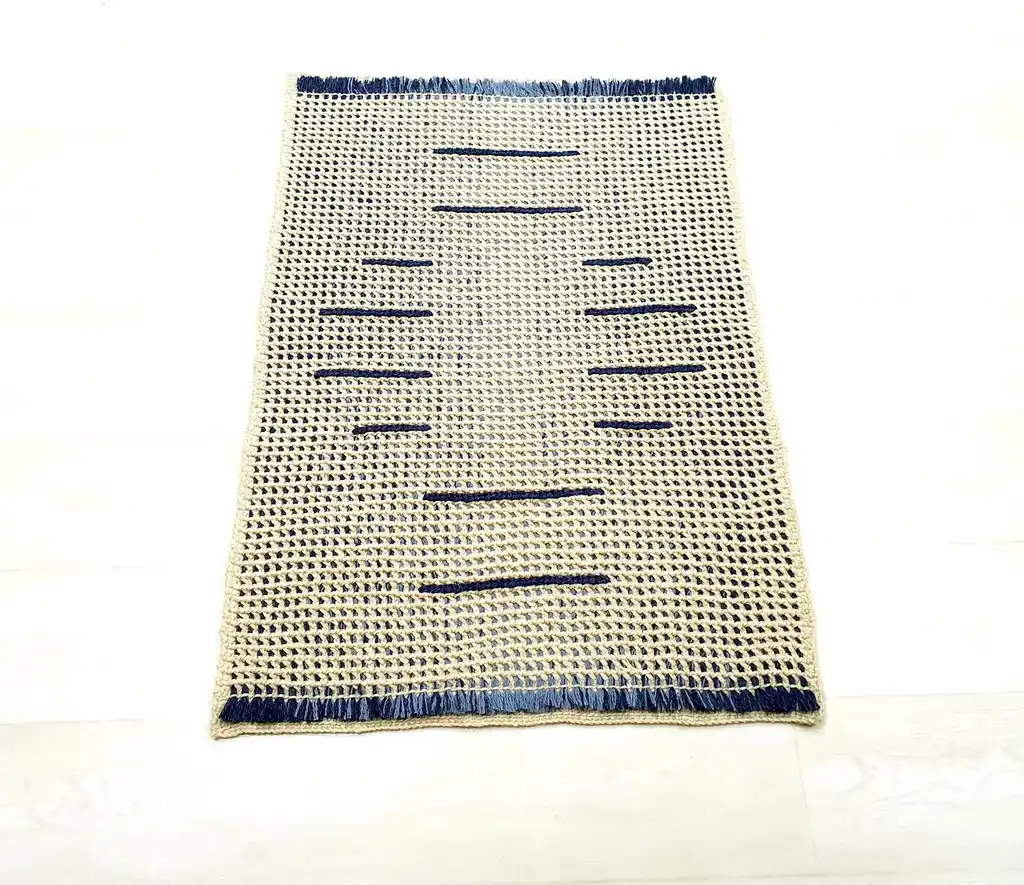 handmade crochet wool rug with intricate pattern, machine washable home decor.