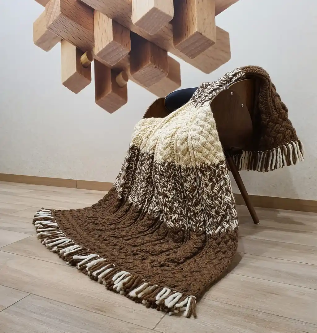 luxury merino wool knitted throw blanket in elegant design.