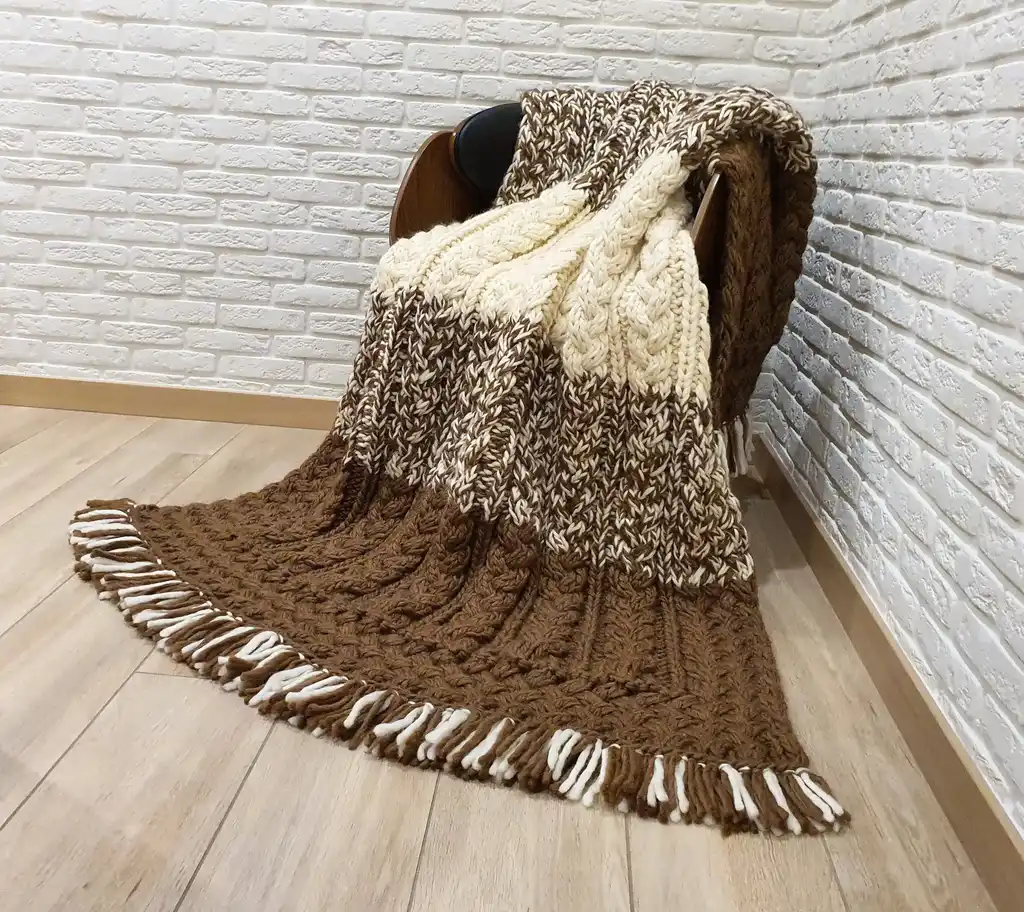 luxury merino wool knitted throw blanket in elegant design.