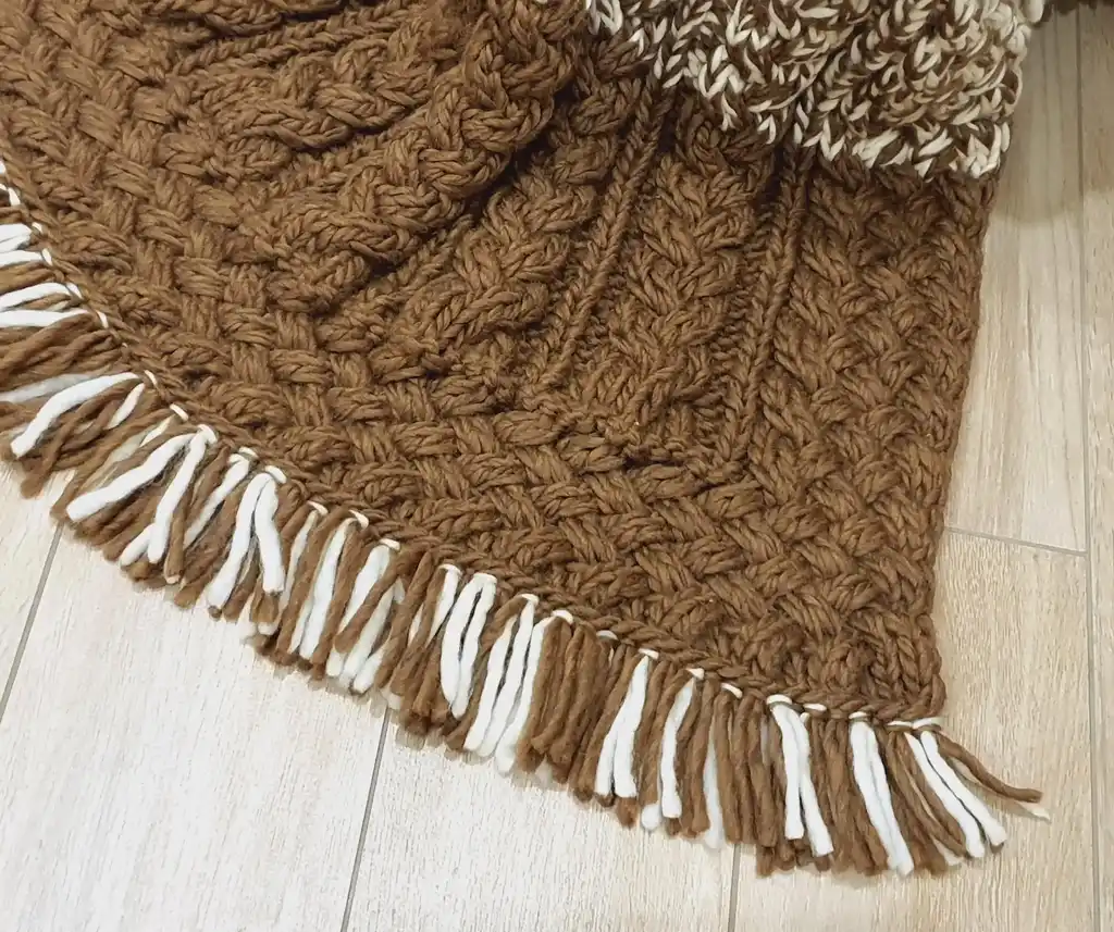 luxury merino wool knitted throw blanket in elegant design.