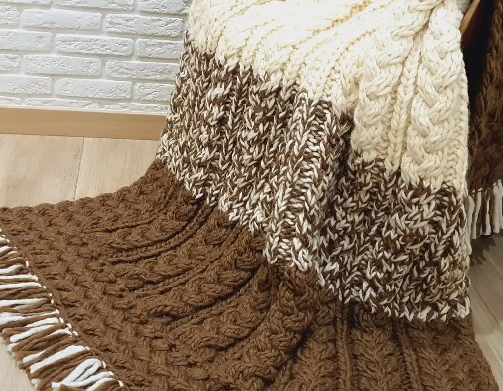 luxury merino wool knitted throw blanket in elegant design.